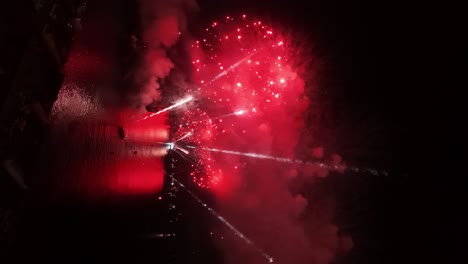 Continuous-discharge-vertical-view-of-the-New-Year's-Eve-fireworks-show-on-the-Chilean-coastline---Valparaiso-at-night