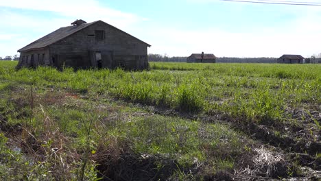 Wooden-cabins-used-by-slaves-still-stand-on-a-plantation-in-the-deep-south