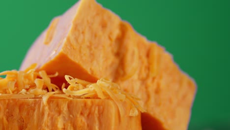 slices of cheddar cheese slowly rotate.