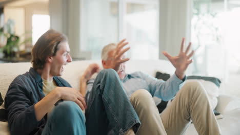 father and son watching sports together