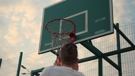 basketball player shooting a dunk