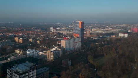 Drone-flight-around-residential-buildings-in-the-city-center-of-Cologne---gentrification-and-modern-high-rise-buildings-from-the-70s-in-the-cityscape-of-Köln,-Germany---Aerial-shot