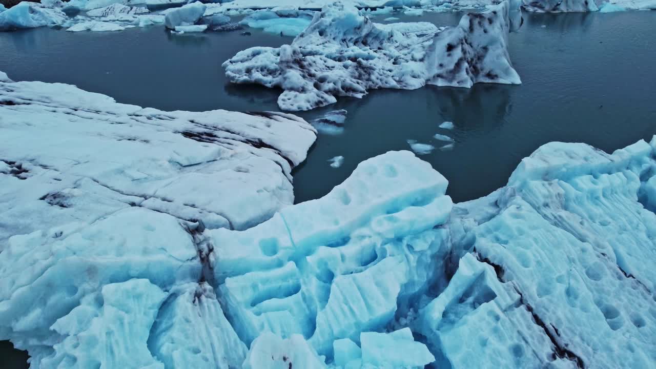 Drone shot flying over J&ouml;kuls&aacute;rl&oacute;n the glacier lagoon Iceland in summer
