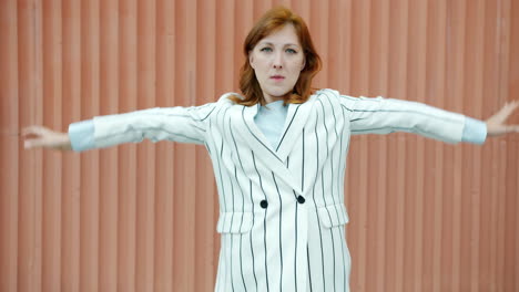 woman in a striped blazer posing