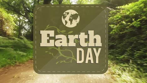 animation of earth day text over forest