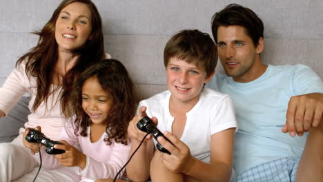 family playing at video game