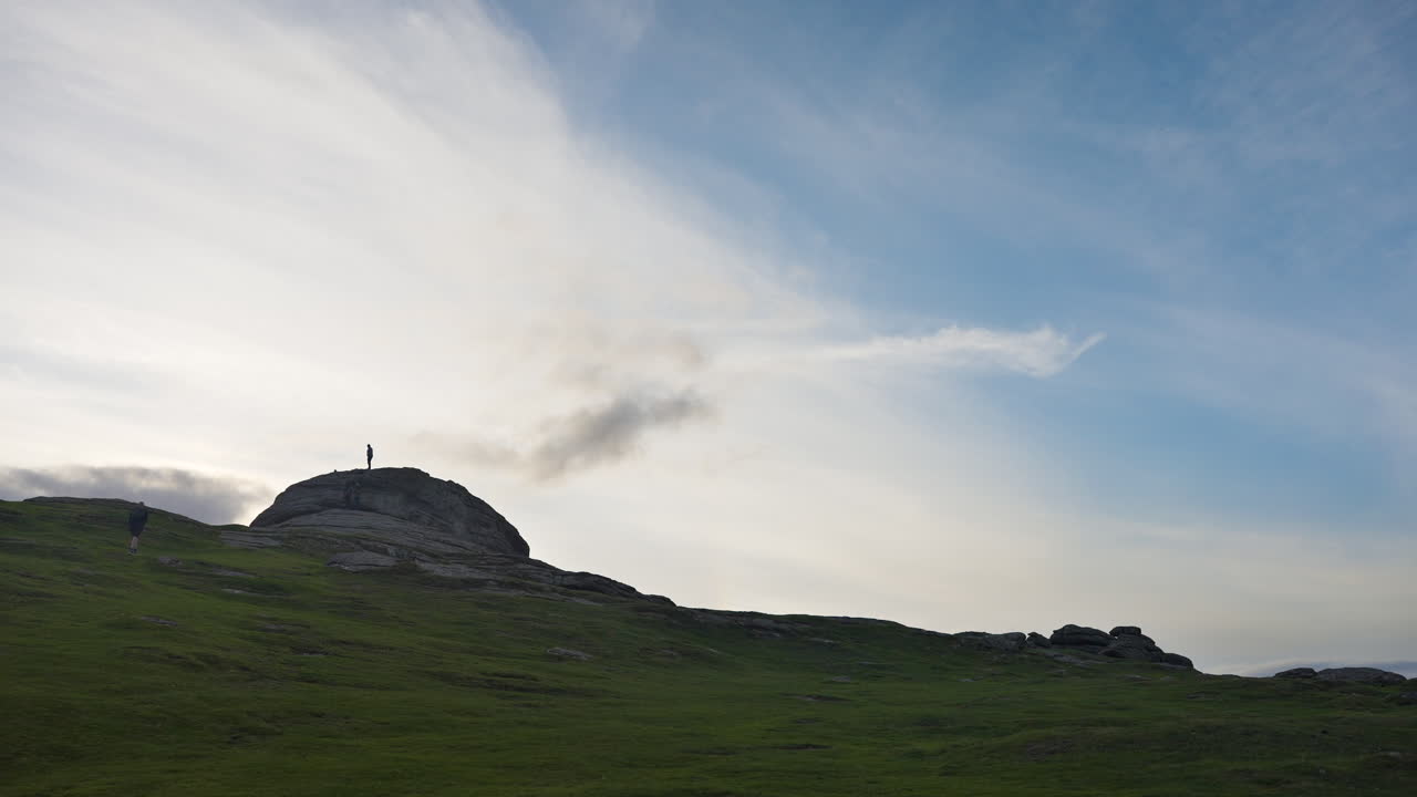Hikers on Mountain Top at Sunrise