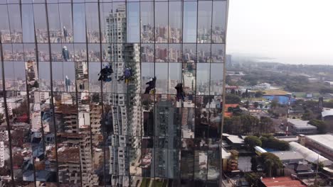 aerial - window washers, high rise building, buenos aires, argentina, circle pan