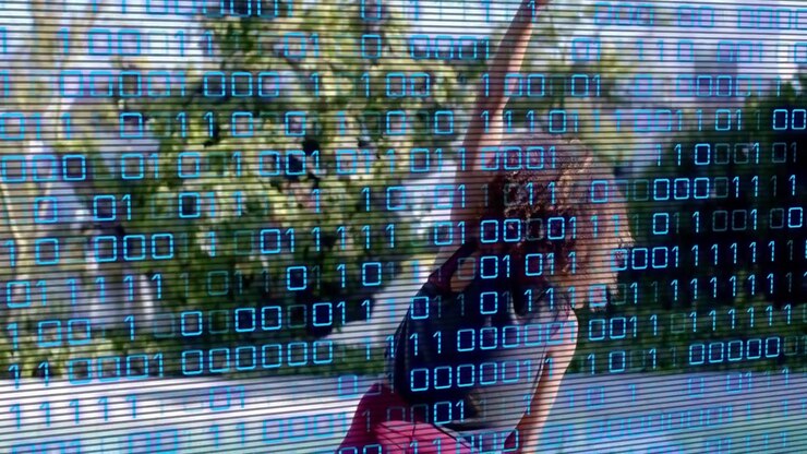 Woman turning, raising right arm, stretching while tech binary scanlines partly obscuring her