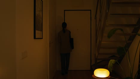 woman walking through the apartment at night