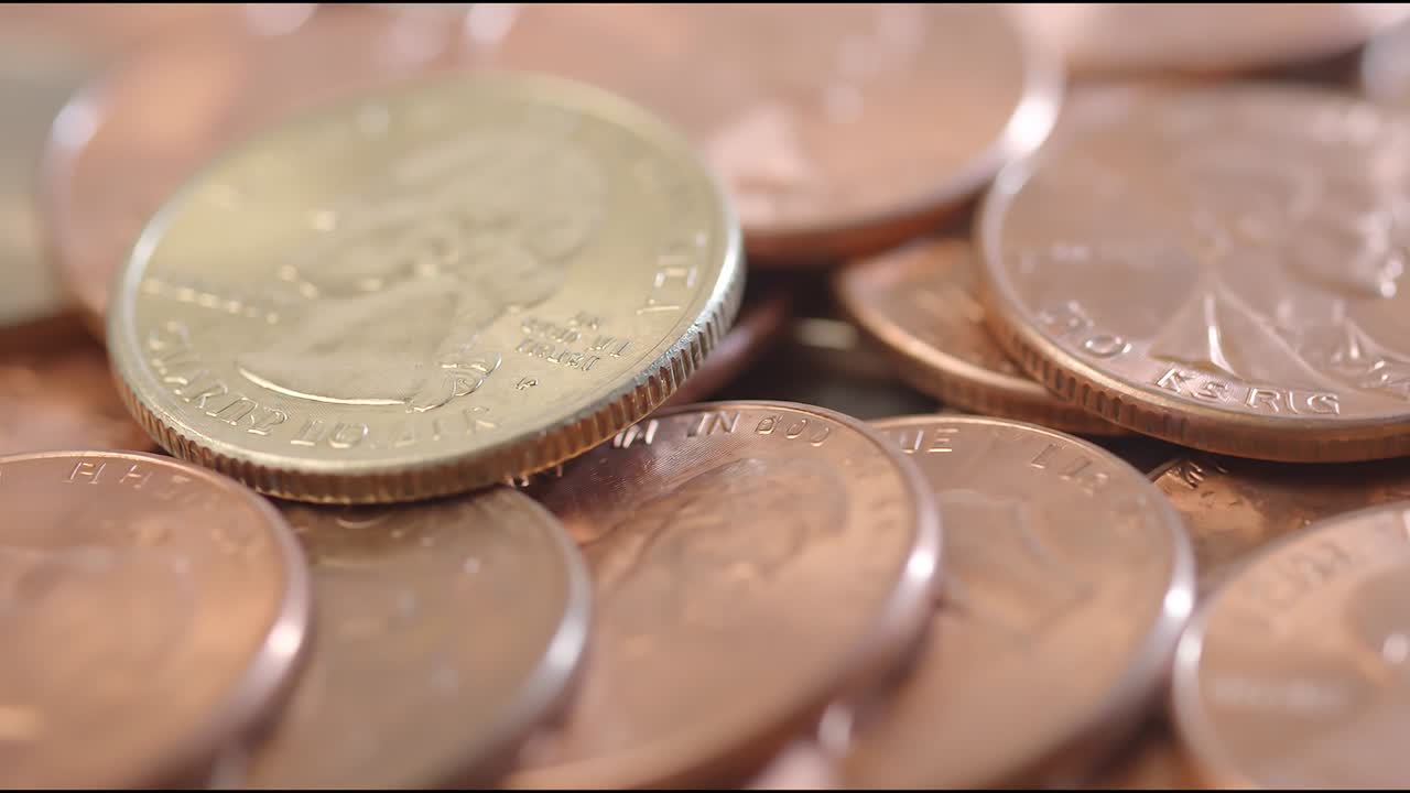 Macro close up of mixed coins and currency pieces representing savings economy and money concept