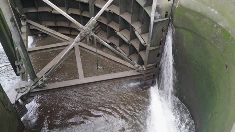 dam doors are shut and water keeps flowing from the sides of gates constantly