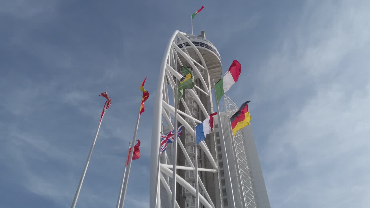 Pan up shot of vasco da gama tower in Lisbon Portugal