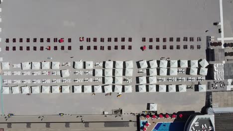 overhead drone shot of mamaia, a popular beach resort in romania, located by the black sea, known for its fine sand, vibrant nightlife, great restaurants, and a perfect getaway during summer months