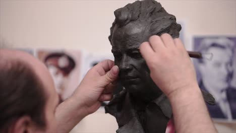 sculpting a clay bust