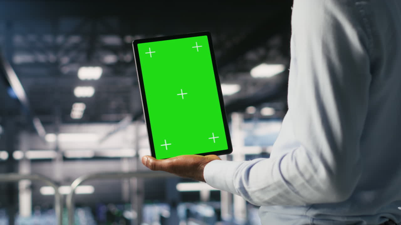 Data center engineers on industrial platform using isolated screen device