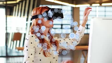 Animation-of-globe-with-network-of-connections-over-businesswoman-wearing-vr-headset