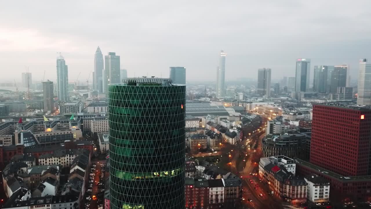 rising up with a tower in front and the skyscrapers of frankfurt in the background
