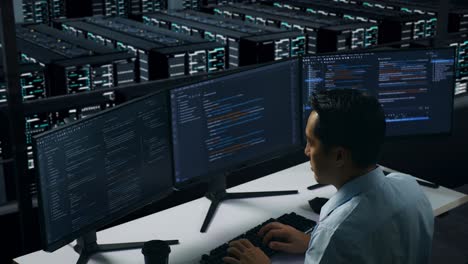 it specialist working in a server room