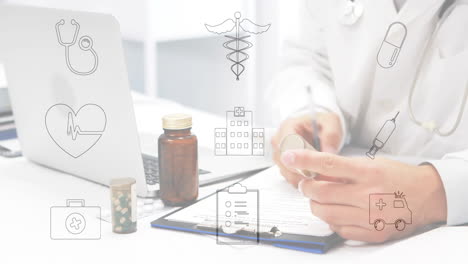 medical icons animation over doctor working with laptop and medication on desk