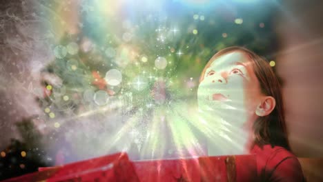 Girl-opening-Christmas-gift-with-magical-light