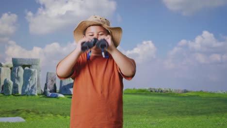 Asian Boy With A Hat Wipes His Sweaty Face After Looking Through The Binoculars. Boy Researcher Examines Something While Traveling In Stonehenge, Travel Tourism Adventure Concept