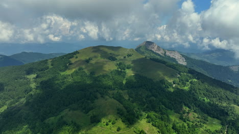flight over green mountain peaks