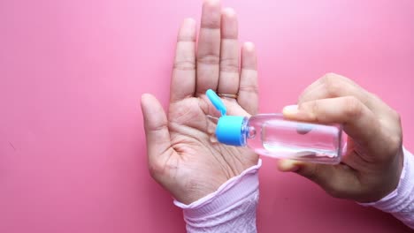 applying hand sanitizer