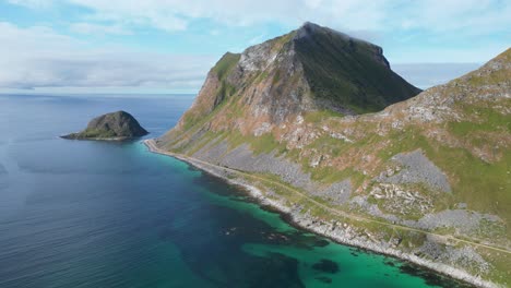 Lofoten-Islands-Steep-Mountain-Coastline-near-Haukland-Beach---Aerial-4k