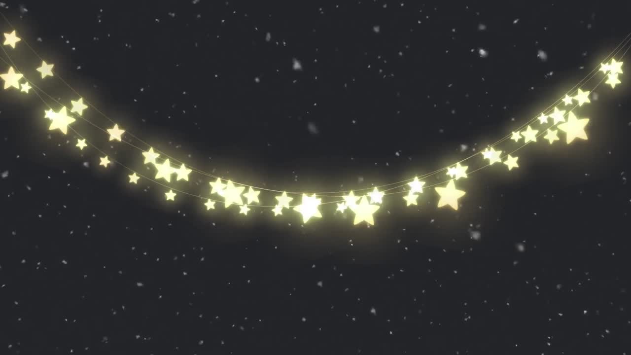 クリスマスの妖精のライトと黒い背景に降る雪のアニメーション