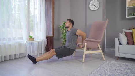 Young-man-doing-triceps-dips-on-the-couch.