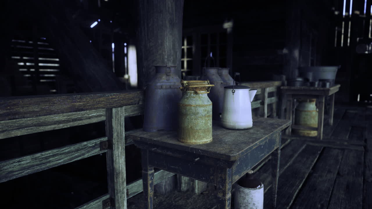 Vintage milk cans and jars lined on wooden tables in a rustic barn setting