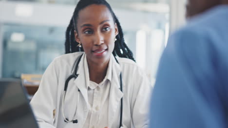 Doctor,-laptop-and-discussion-with-nurse