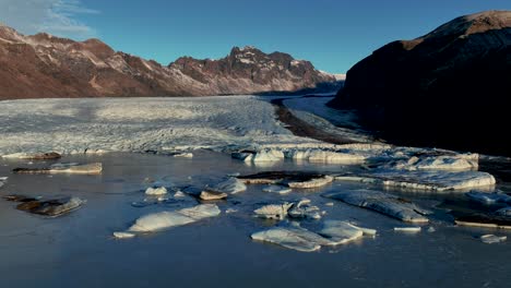 skaftafellsjokull glacier tongue and lagoon in south iceland - drone shot