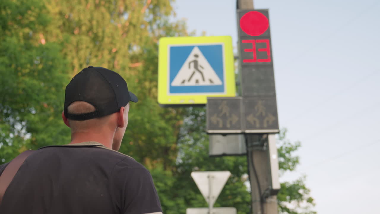 Urban Cautious Glance, Man Observes Traffic At Intersection, Closeup Of Man Watching Busy Crosswalk, Profile Of Man Cautiously Observing Traffic Signals Amidst Bustling City Intersection