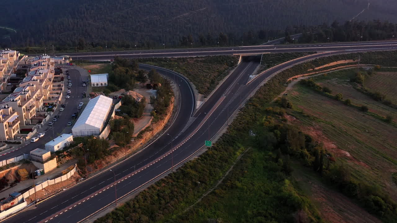 Aerial view of a highway interchange next to a residential area