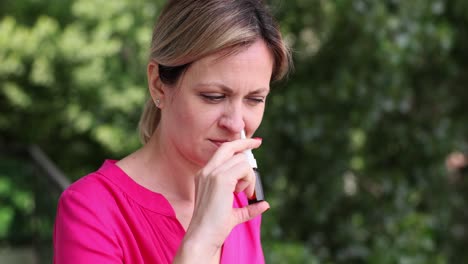woman using nasal spray