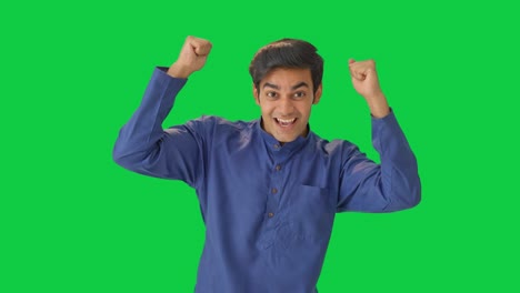 cute indian boy cheering and appreciating green screen