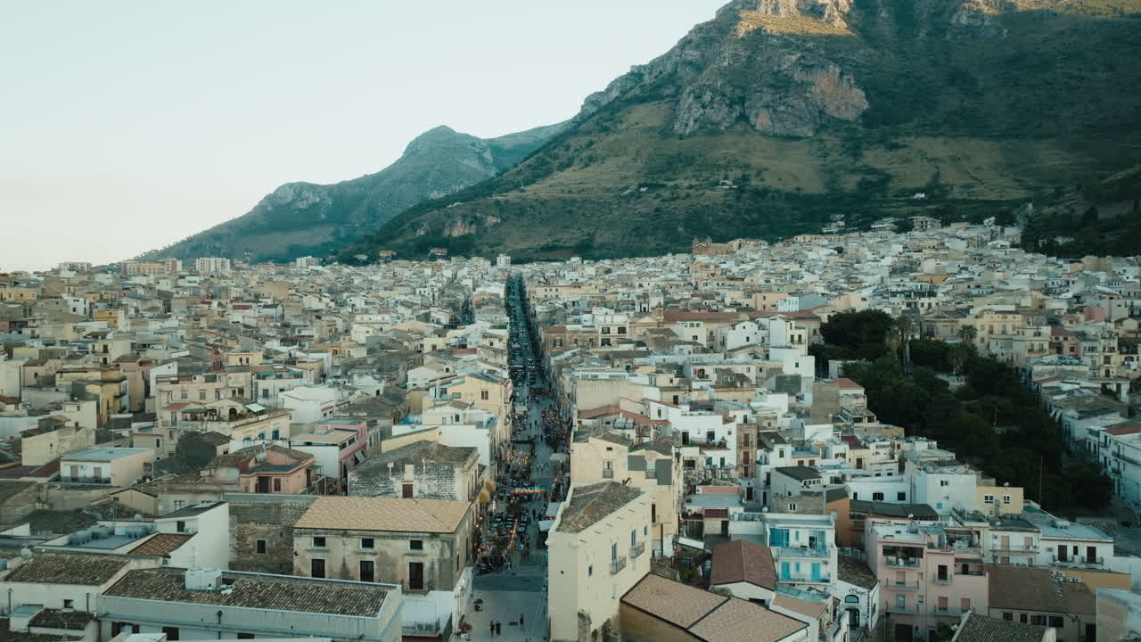 Cinematic aerial over Corso Giuseppe Garibaldi Castellammare del Golfo after sunset Sicily Italy Part 2