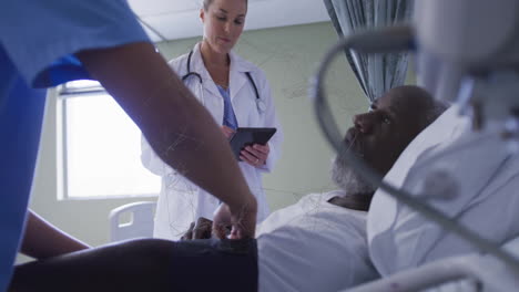 consulting patient in hospital bed, doctor using animation with digital network