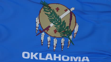 flag of oklahoma state, region of the united states, waving at wind