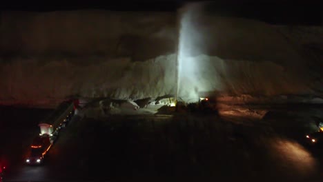 overhead view of a snow blower and crews in trucks clearing snow with equipment