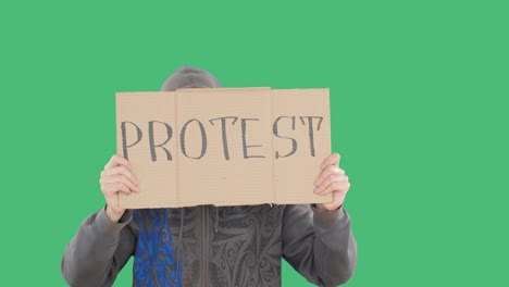 unrecognizable man showing cardboard with protest sign on strike on green screen. protester person holding cardboard on social rally. political unrest and rebellion.