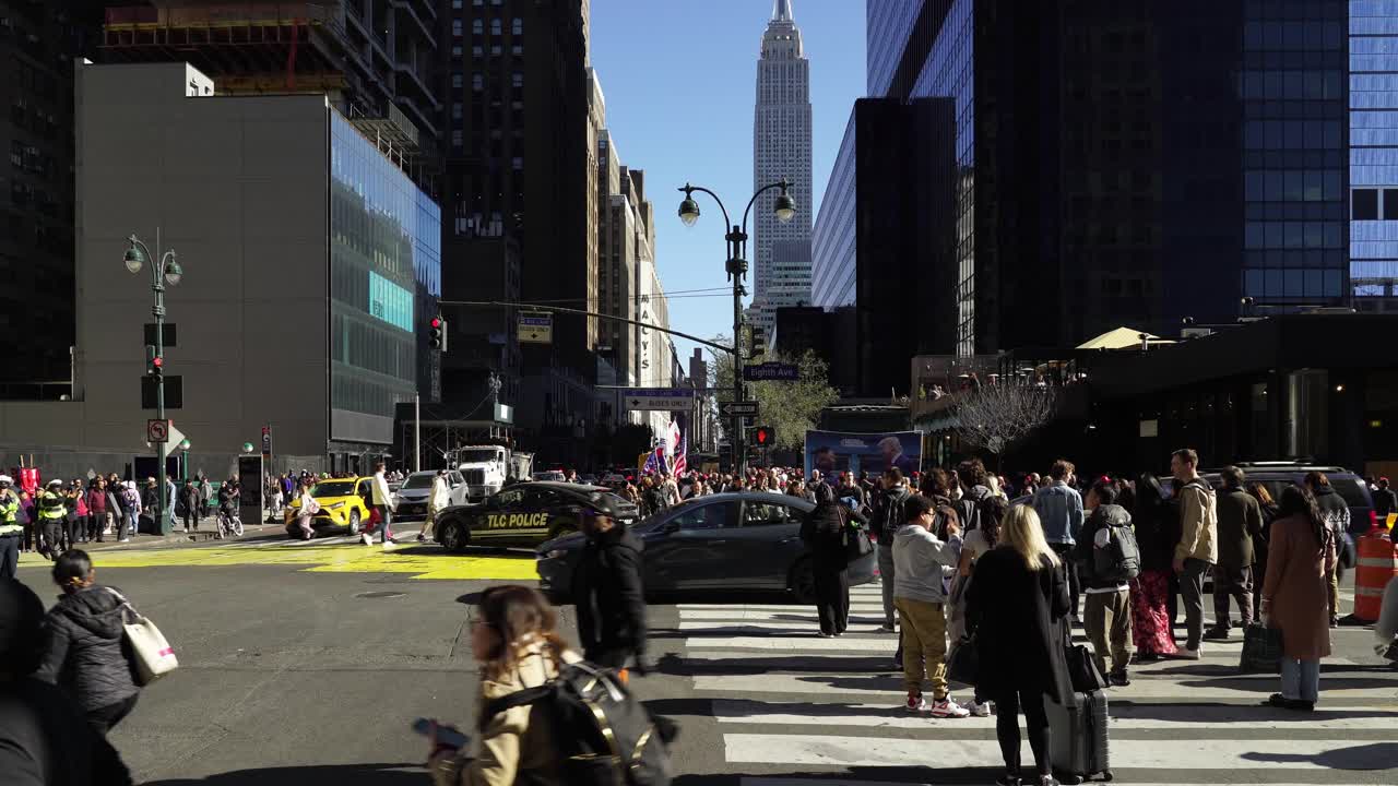 Under the clear blue sky, Trump’s supporters gather near Madison Square Garden, their faces lit up by the afternoon sun