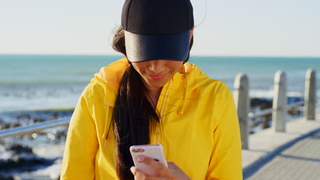 Selfie,-happy-and-woman-at-the-beach-with-a-phone