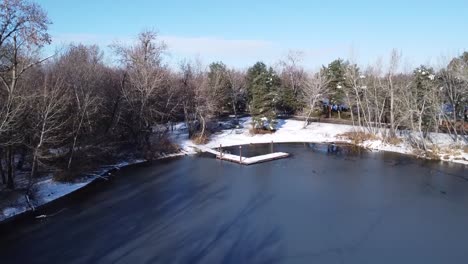 Drone-Footage-Of-A-dock-In-The-Snow-And-Ice