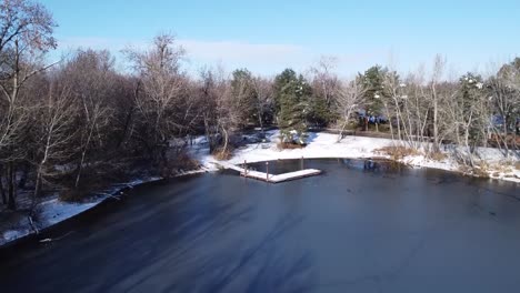 drone footage of a dock in the snow and ice