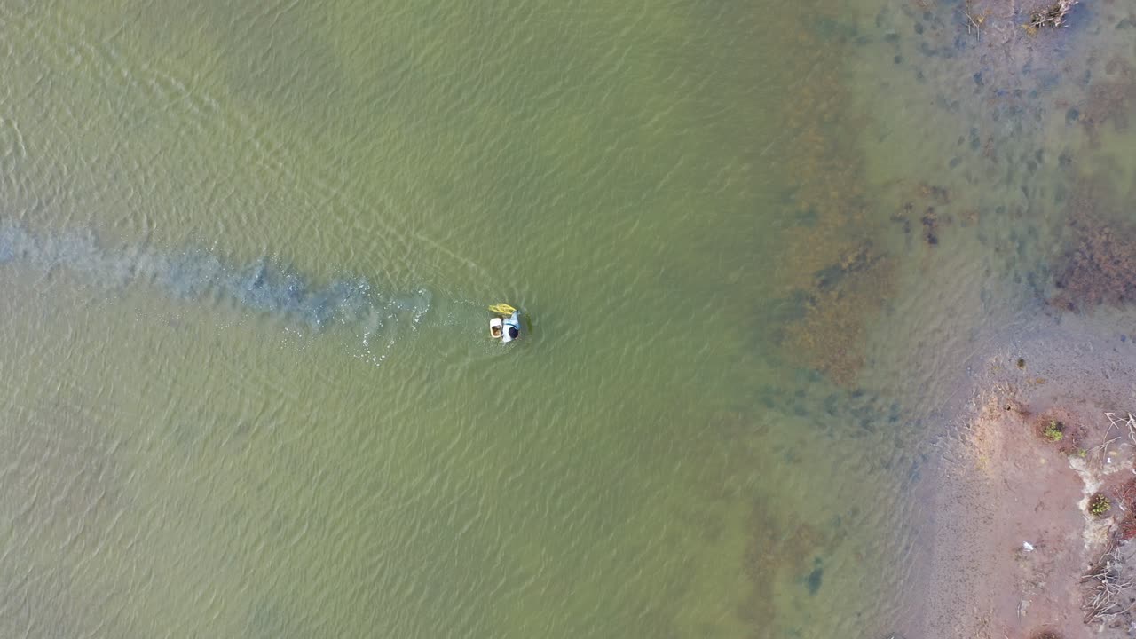 Person Fishing in a Lake