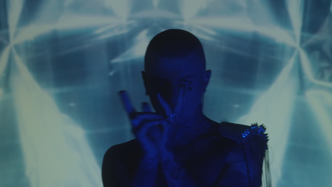 Man Dancing in Studio with Light Projection