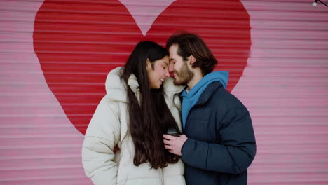 man and woman hugging on the street